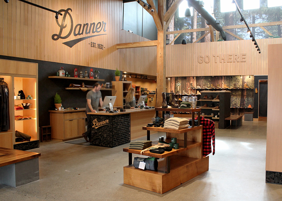 an additional view of the Danner Boots sales floor. The counter made with lava rock in visible along with plenty of wooden accents
